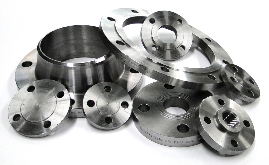 Assorted carbon steel flanges including weld neck, blind, threaded, and slip-on types
